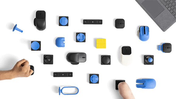 Image of all Microsoft adaptive accessories laid out in a grid pattern.